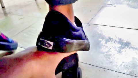 Woman's black Vans sneaker trampling man's exposed hard cock and balls on floor