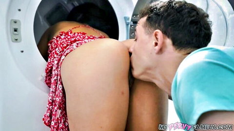 Guy kisses tanned babe's bare ass as she bends over inside washing machine