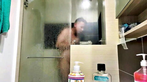 Latino man in steamy shower using his plaything solo