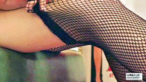 Breezy Bri in black fishnet stockings, seductive leg-up tease