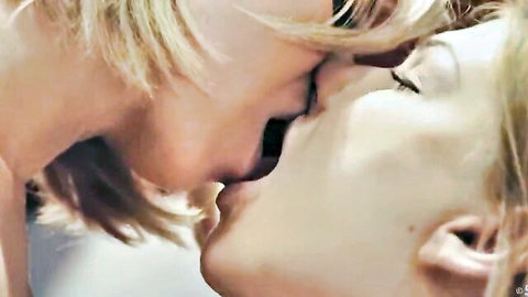 Lucy Heart and Vicky Love sharing a passionate lesbian kiss