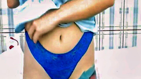 Light-haired beauty in blue lace panties teasing midriff