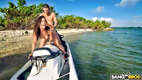 Kelsi Monroe topless on jet ski with stud in tropical waters