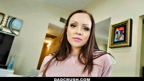 Brunette stepdaughter puckers plump lips smiling seductively in pink sweater POV tease