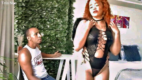 Curvy redhead in black lace lingerie teases black man passionately