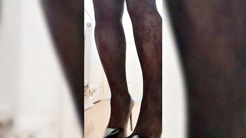 Ebony babe's sexy long legs in black stockings and stiletto high heels teasing
