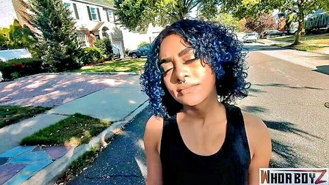Blue-haired Puerto Rican woman with big ass in black tank top outdoors