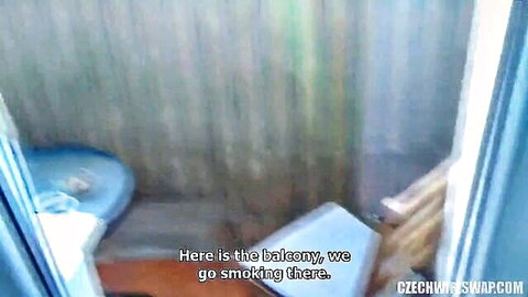 Empty bedroom with blue bed and balcony door in Czech wife swap video preview