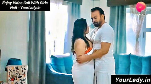 Indian busty woman in saree embraces muscular man intimately