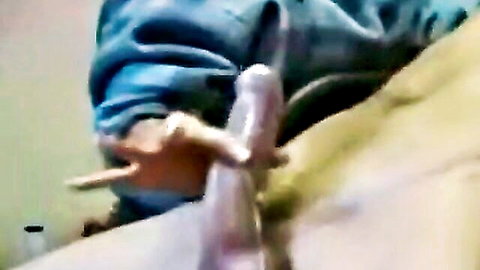 Close-up of intense handjob grip on erect penis with lube