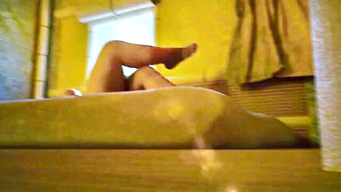 Animated giantess vore scene with nude legs and feet spread on bed
