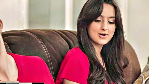 Sexy brunette in tight red dress spreads legs wide teasing on leather couch