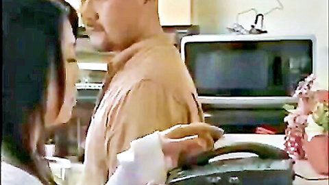 Intimate moment between Japanese couple in kitchen from Japanese Love Story