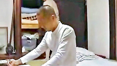 Mature Japanese man in white shirt, intimate home scene from Hot Japanese Stepmom