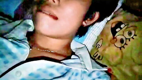 Joy, sexy Filipina in bed with SpongeBob pillow, close-up teasing smile