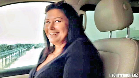 Smiling MILF with deep cleavage in car passenger seat public parking amateur Czech