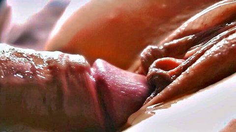 Extreme close-up of penis penetrating wet pussy with sperm dripping down