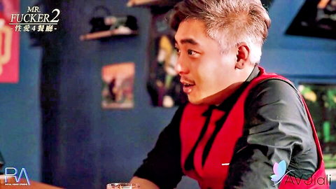 Handsome Asian man with silver hair in red vest, seductive bar scene