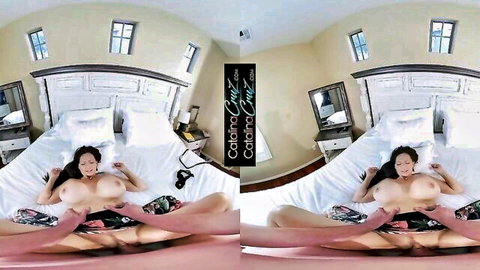 Busty Asian MILF with huge bare tits spreads legs exposing shaved pussy on bed in VR fisheye