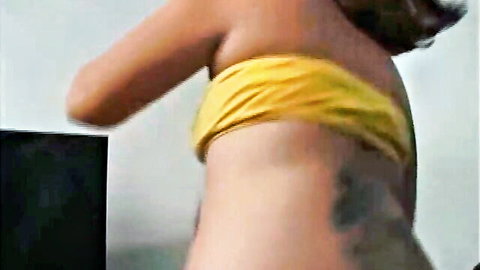 Michelle Santos in yellow bikini top, tattooed curvy back in lesdom fart fetish