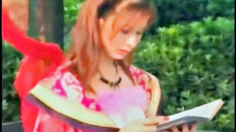 Taiwanese softcore beauty in floral dress reading book outdoors, red hair