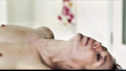 Aiden Ashley nude lying on back with exposed breasts in sexy pose