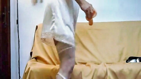 Sissy Gabriella in white lingerie holding dildo solo masturbation