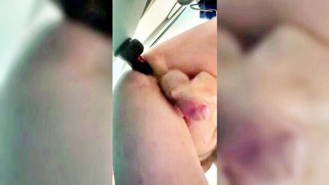 Blurry close-up of man inserting thick black dildo into his tight pink asshole solo anal masturbation