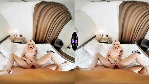 Blonde babe legs spread wide on bed fingering shaved pink pussy intensely