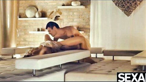 Muscular stud fucks blonde babe's pussy missionary style on white couch