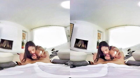 Busty Marta La Croft giving VR blowjob to man on bed