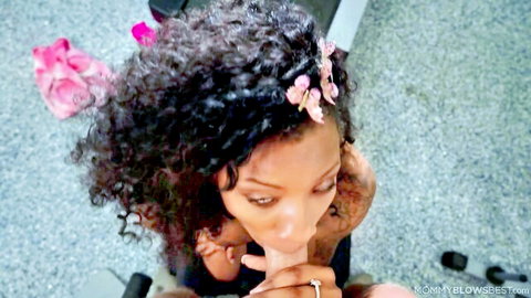September Reign curly ebony MILF giving blowjob to Ryan McLane in gym