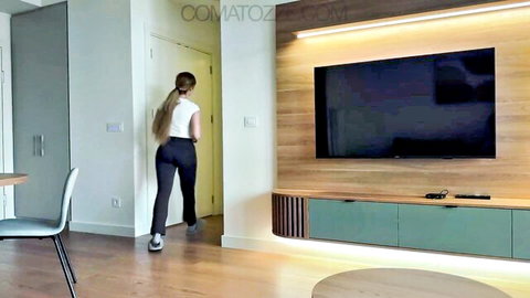 Young busty maid in tight white top and black pants, ponytail, from behind