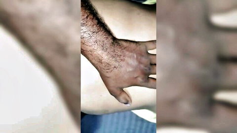 Hairy man's hand intimately touching sexy wife's smooth thigh and curves