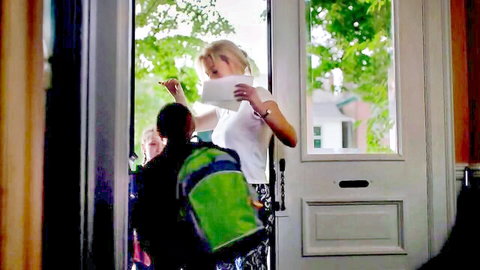 Gillian Anderson in casual white top at home door, family scene from I'll Follow You Down (2013)