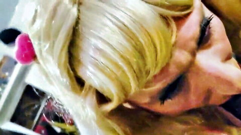 Blonde with pink bow and heavy makeup deepthroats cock in closeup