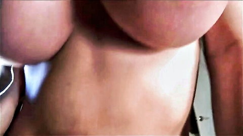 Busty fair-skinned MILF's massive bare tits in close-up view