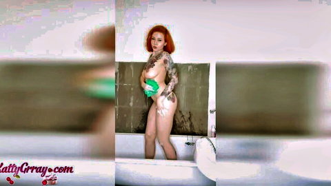Tattooed ginger redhead topless in bathtub washing curves - homemade amateur