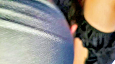 Close-up of Asian woman in tight blue jeans, hand grabbing curvy ass from behind