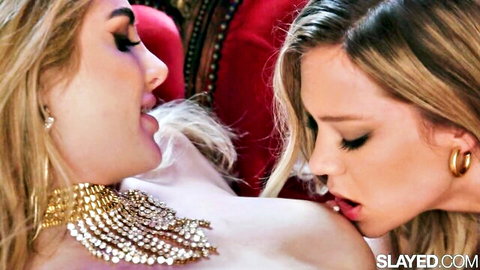 Two skinny blonde lesbians passionately kissing with small tits exposed in steamy foreplay