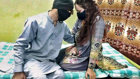 Desi Bhabhi in traditional salwar kameez with masked lover, intimate couple scene