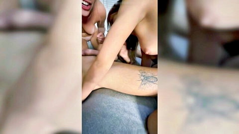Two nude friends with benefits in intimate threesome, arm tattoo visible