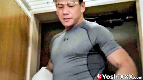 Muscular Asian stud in tight grey compression shirt posing