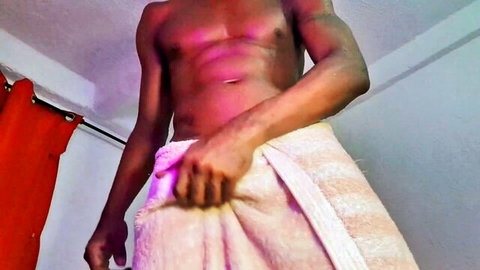 Muscular black man with big lubricated cock jacking off post-shower