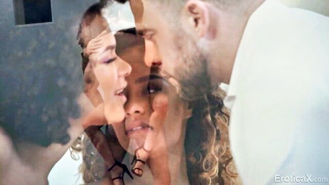 Hot ebony women with curly hair passionately kissing bearded man in intimate scene