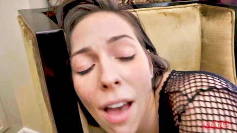 Ecstatic brunette moaning with open mouth and tongue out in sheer black lace top