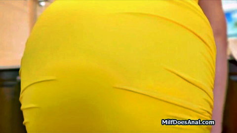 Curvy housewife in tight yellow dress teasing big ass from behind