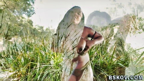 Buxom black beauty in sheer tribal veil posing seductively outdoors with Jon Jon