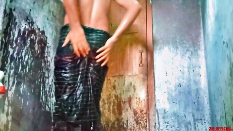 Amateur South Asian man grabs wet clinging lungi exposing ass in steamy shower