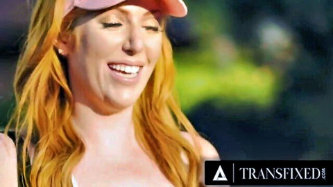 Busty redhead MILF Lauren Phillips smiling in pink cap